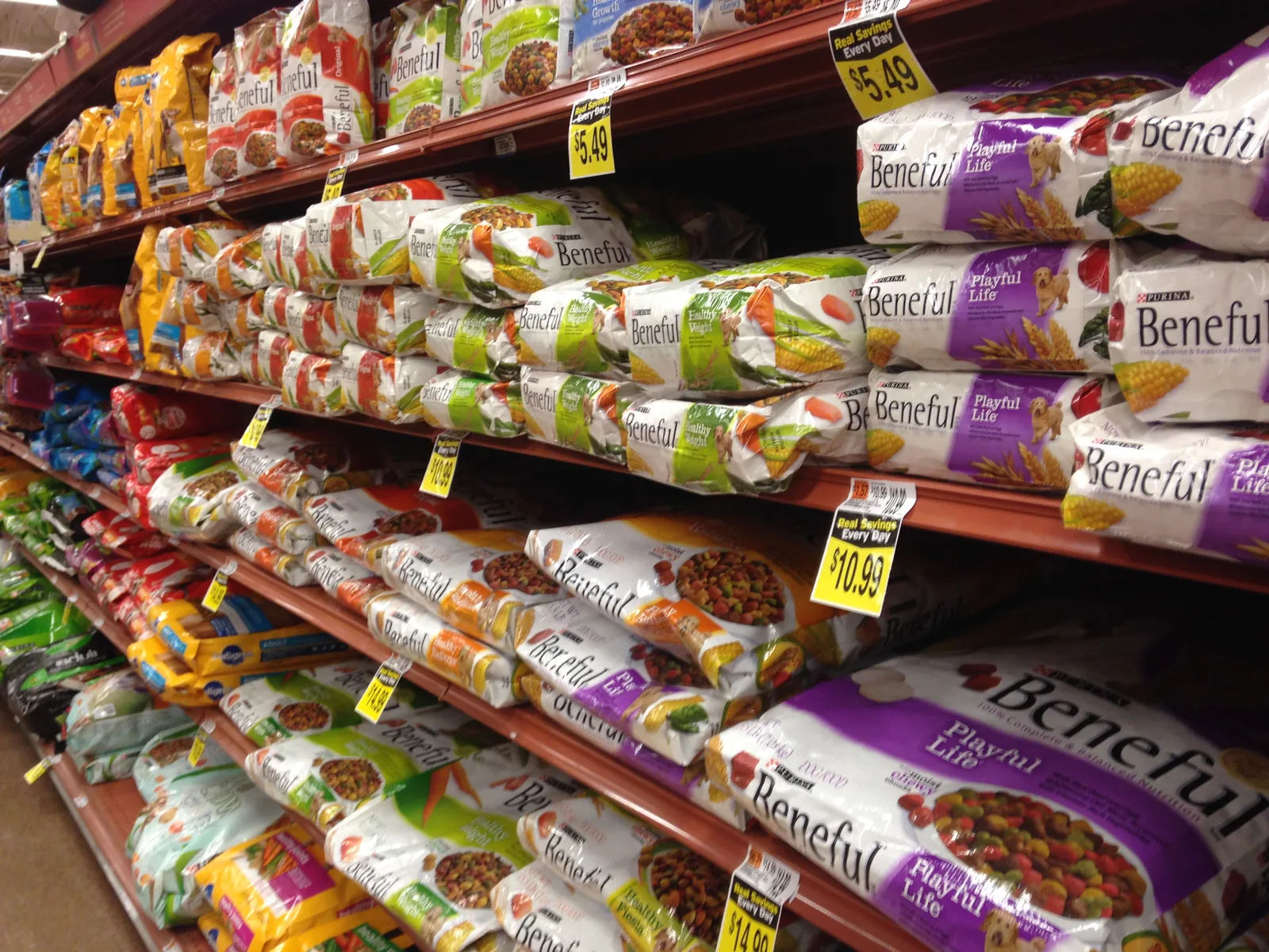 Different packaged dog foods displayed in a store